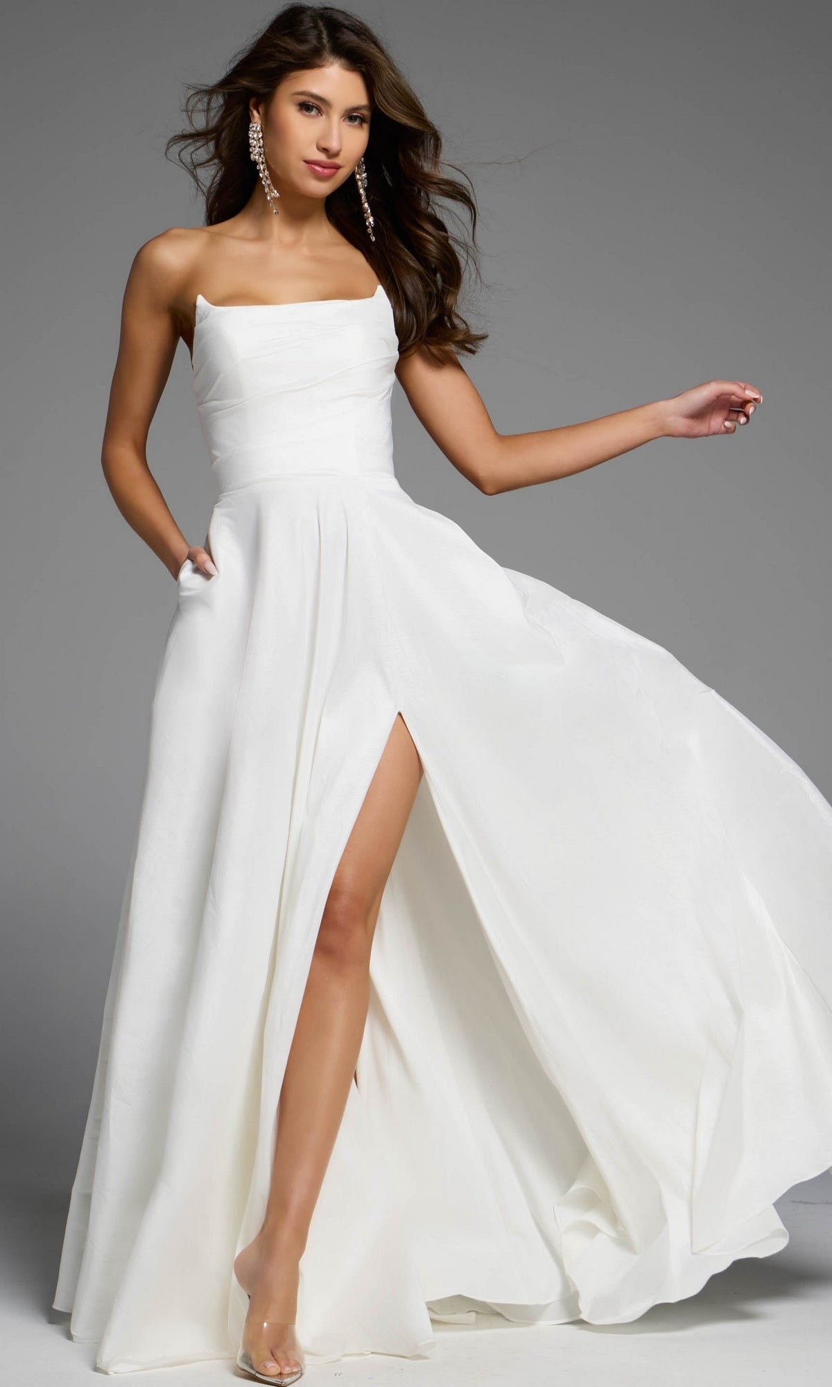 Jovani D5822 strapless white floor-length A-line prom dress with a square neckline, side pockets, and a high leg slit.
